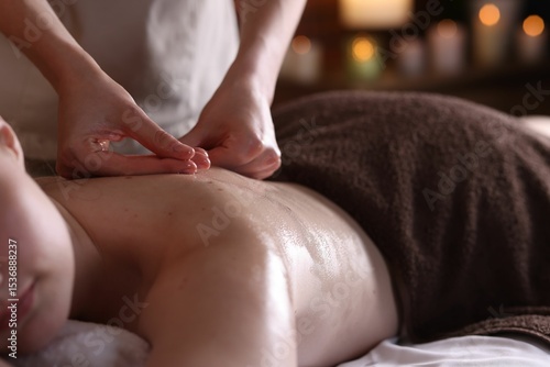 Wallpaper Mural Woman receiving back massage with oil in spa salon, closeup Torontodigital.ca