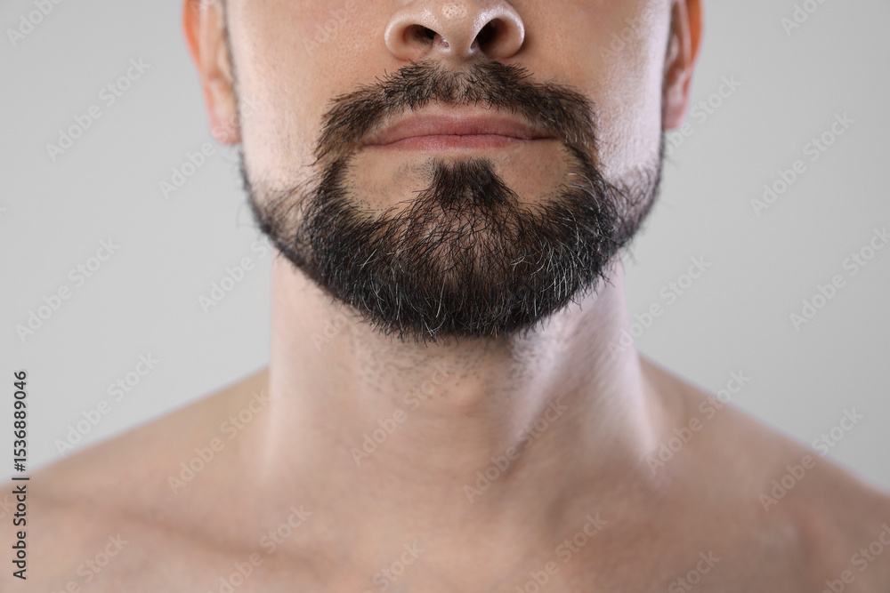 Obraz premium Man with beard on grey background, closeup