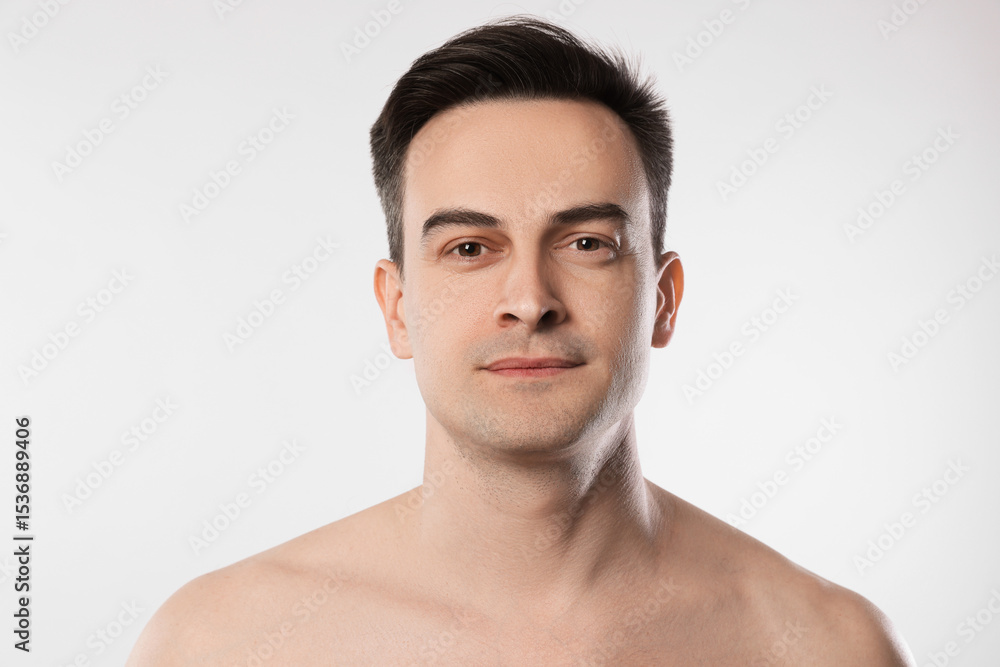 Fototapeta premium Portrait of handsome man on light grey background, closeup