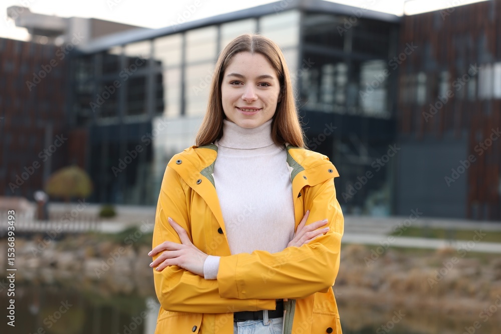 Fototapeta premium Portrait of beautiful teenage girl on city street