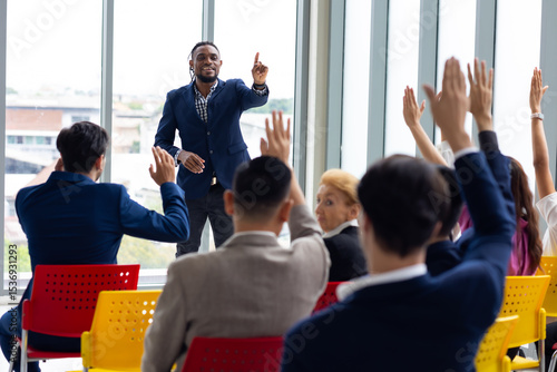 Fototapeta Question and answer audience or crowd : Active participation Asian man raise han