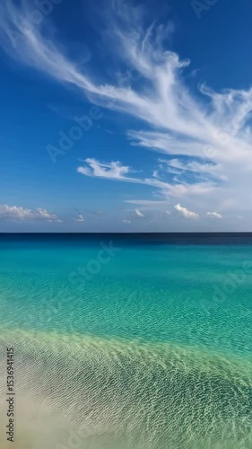 Wallpaper Mural Azure ocean landscape with clear turquoise water, white sand beach and wispy cirrus clouds under bright blue summer sky Torontodigital.ca