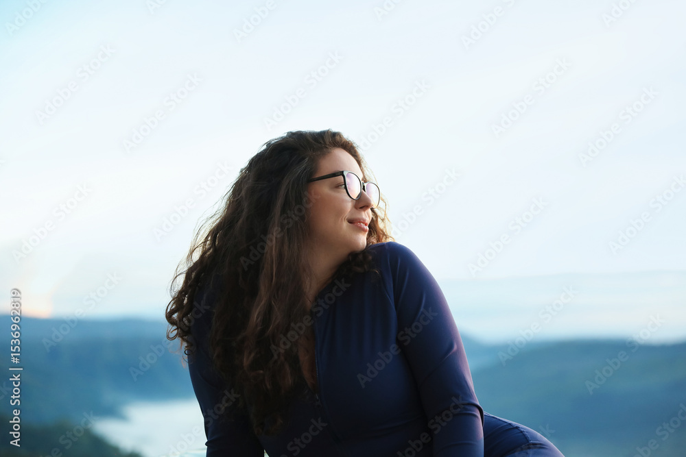 Beautiful woman enjoying picturesque view of mountains Beautiful woman enjoying picturesque view of mountains