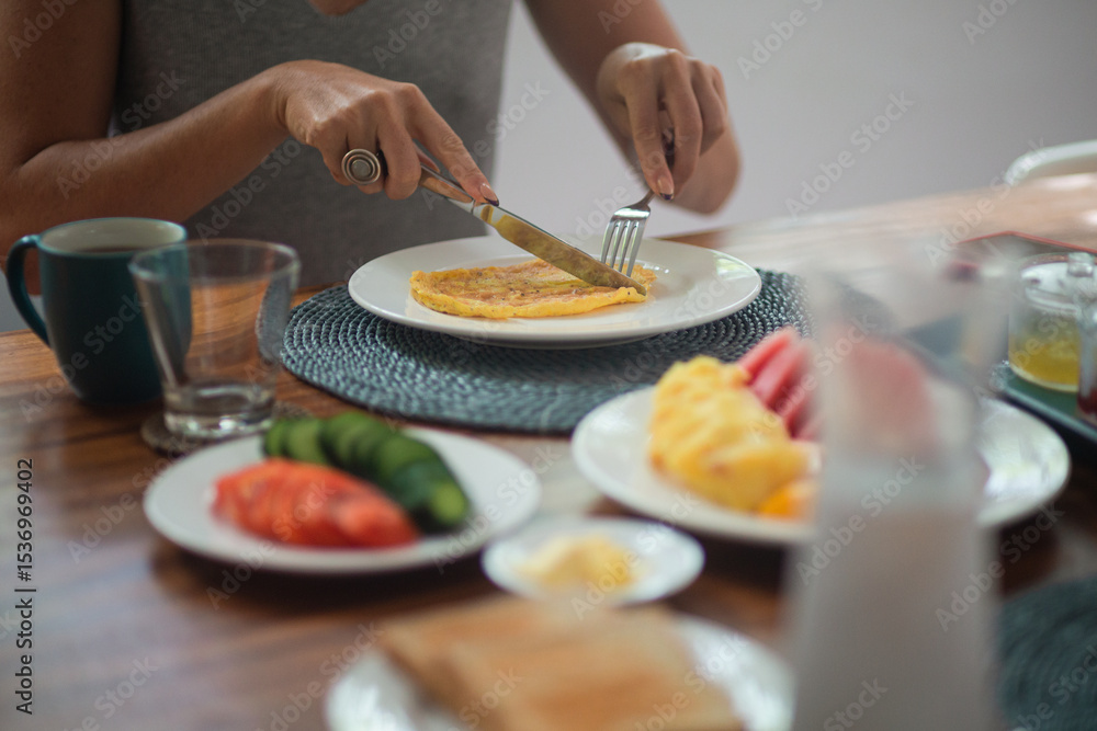 Healthy Breakfast Table with Omelette, Sliced Fruits and Vegetables Healthy Breakfast Table with Omelette, Sliced Fruits and Vegetables