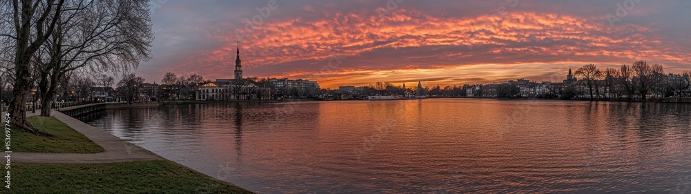 Fototapeta premium Ombre Sunset Over Tranquil Lake with Body of Water