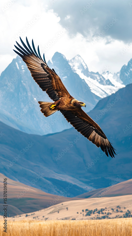 Naklejka premium Eagle soaring in sky over African plains with mountain backdrop
