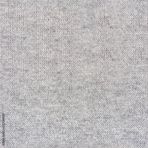 Seamless 4k photo texture of light gray colored wool knitted sweater material.
