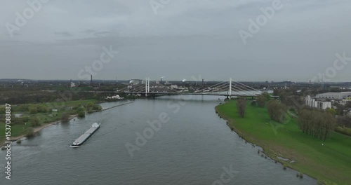 Wallpaper Mural Aerial video of a bridge over the Rhine River in Duisburg, Germany, focusing on traffic infrastructure, waterway, and road crossing Torontodigital.ca