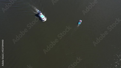 Berlin Spandau Aerial view of a riverside promenade with small boats docked along the edge