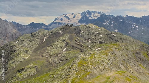 Mountains with glaciers under a cloudy sky in La Vanoise national park, Savoie, France 