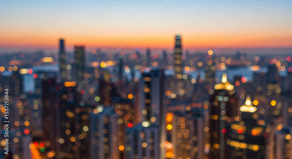 Fototapeta premium Evening Cityscape A Blurred Panorama of Urban Lights and Skyscrapers at Sunset