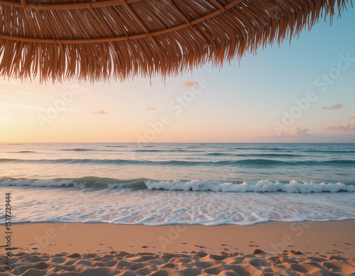 A wide-angle seaside landscape at dawn, with gentle waves lapping an empty sandy beach. The sky is painted in pastel hues of pink, peach and light blue
