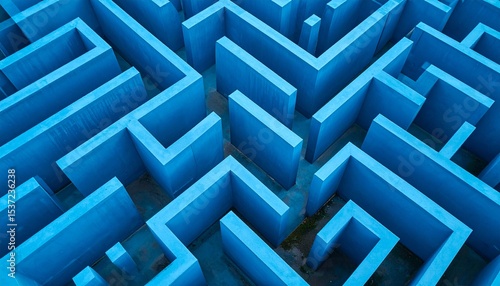 A stunning aerial view of a bright blue maze showcasing intricate winding paths and sharp geometric patterns under natural light, creating a vibrant, futuristic labyrinth design from above