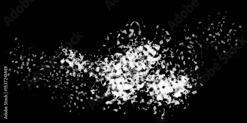 Snowflakes on dark background. white icy snowflakes isolated on black background, natural background. white crystalline powder on a black background. sugar dust. texture, pattern and clipping.