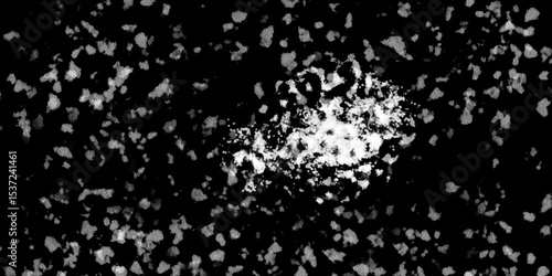 Snowflakes on dark background. white icy snowflakes isolated on black background, natural background. white crystalline powder on a black background. sugar dust. texture, pattern and clipping.