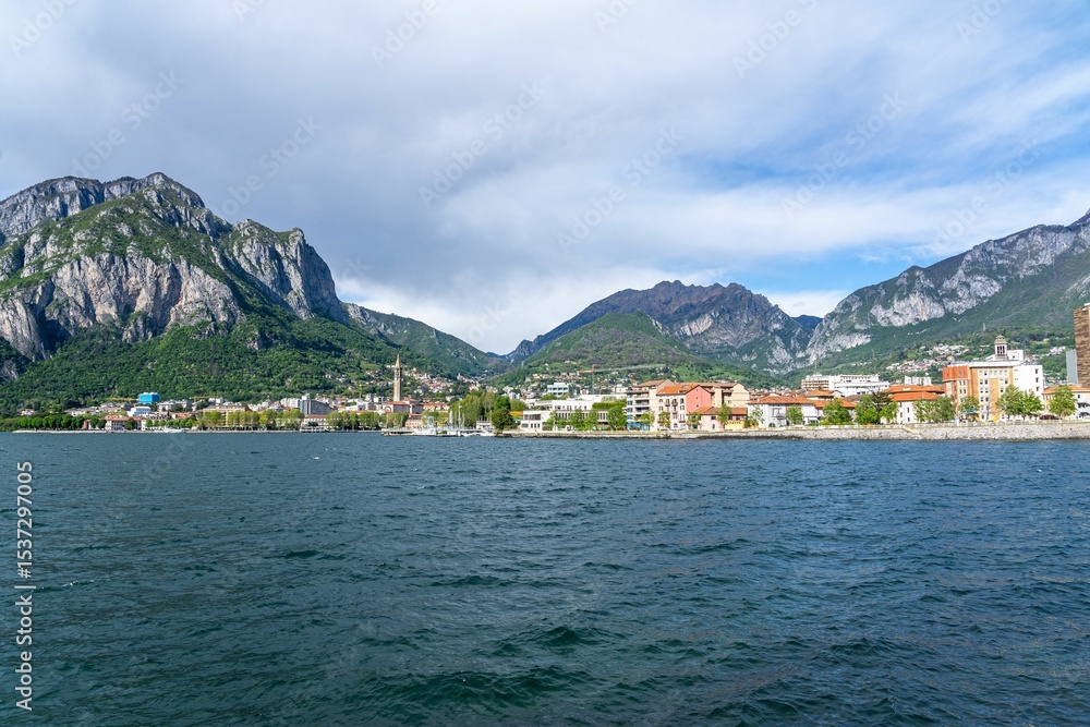 Fototapeta premium Scenic view of Lecco city with mountains and lake.