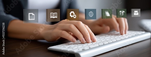 Close-up of a hand engaged in typing on a laptop, surrounded by glowing digital book icons, representing e-course learning and education