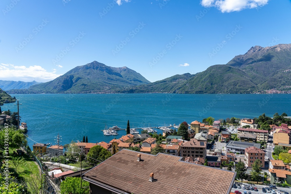 Fototapeta premium Lake Como scenic view with mountains and town.