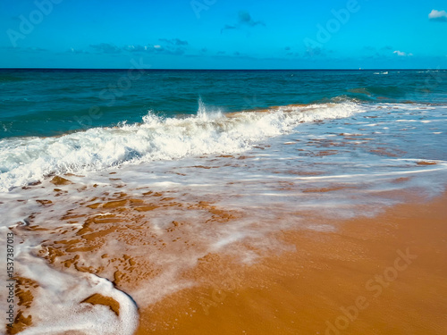 Sandy beach with beautiful clean sea. Warm Mediterranean sea with light waves. Paradise place for relaxation, vacation, tourism. Lonely sandy beach with beautiful waves. Beach of Israel, Ashkelon.