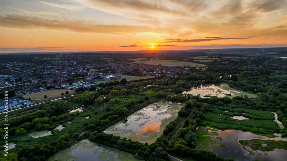 Fototapeta premium Aerial view of Hoddesdon, Hertfordshire showing river, sunset and housing estate