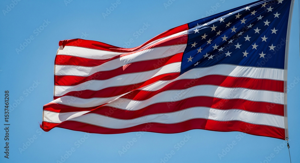 Obraz premium A vibrant United States of America flag proudly waves and flutters against a bright, clear blue sky, symbolizing patriotism, freedom, and national pride. Ideal for Independence Day celebrations