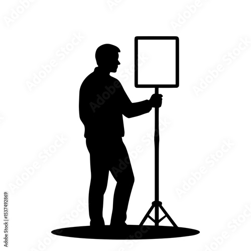 Silhouette of man holding reflector outdoors for Photographer's Day