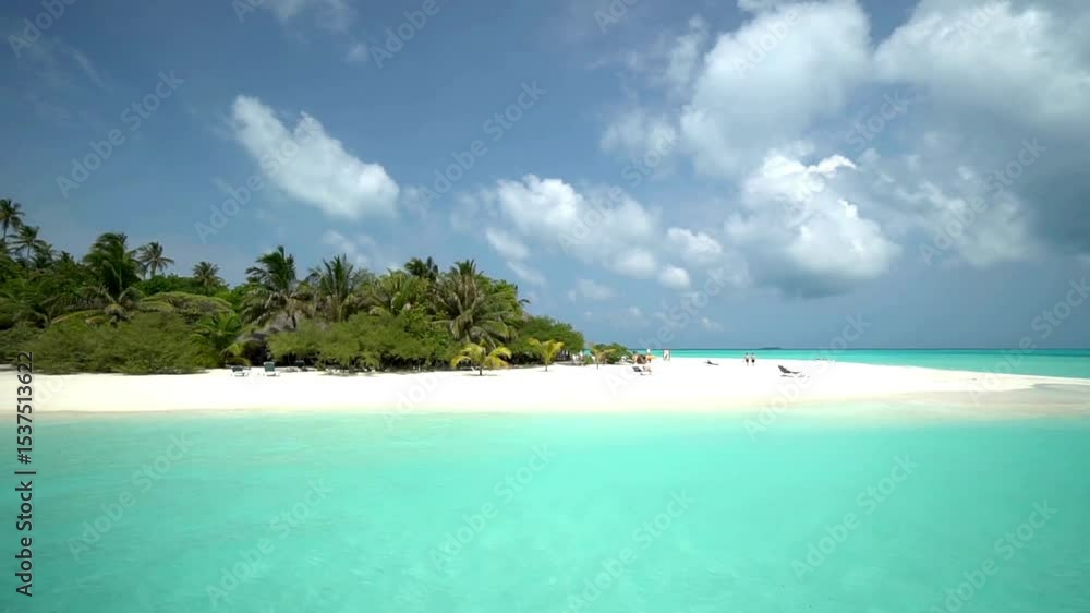 Tropical Island Beach Scene with Turquoise Water and Lush Vegetation Tropical Island Beach Scene with Turquoise Water and Lush Vegetation