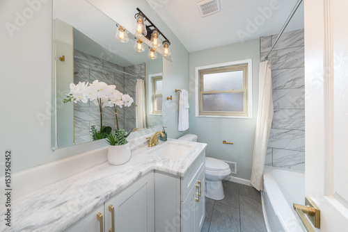 bathroom has been updated with a new vanity new tile and new fixtures installed by a professional