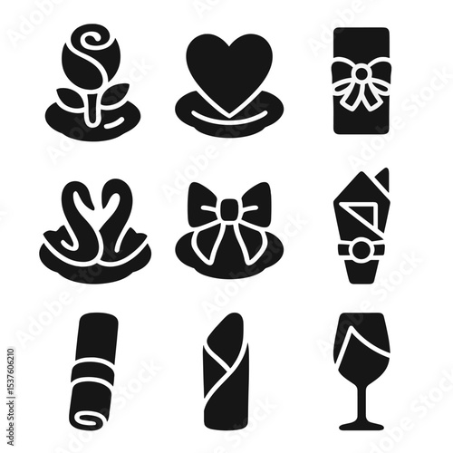 Romantic Napkin Icons. Solid, filled icons set of romantic dinner napkin styles: rose napkin, heart shape,