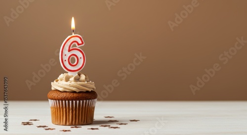 Birthday cupcake with number six candle
