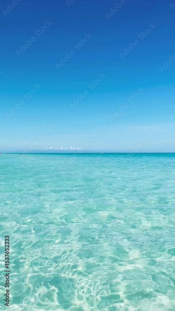 Calm clear ocean blue water reflecting blue sky over the horizon, Varadero beach, Cuba Calm clear ocean blue water reflecting blue sky over the horizon, Varadero beach, Cuba