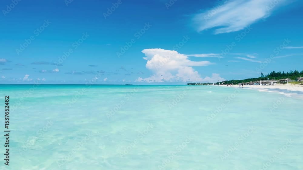 Clear blue calm sea over blue horizon and white sand beach, Varadero, Cuba Clear blue calm sea over blue horizon and white sand beach, Varadero, Cuba