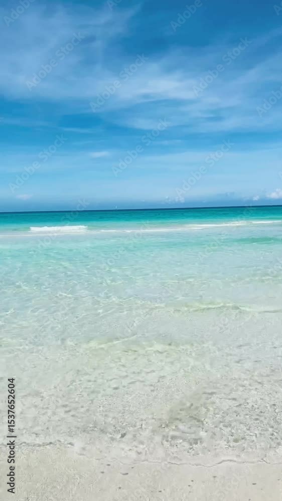 Crystal clear blue sea with soft waves, sunny day on Varadero beach, Cuba Crystal clear blue sea with soft waves, sunny day on Varadero beach, Cuba