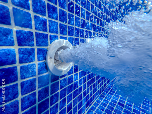 Underwater view of the pool mosaic tile and water jets