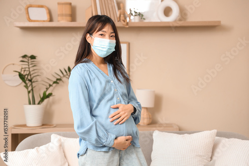 Pregnant Asian woman in med...