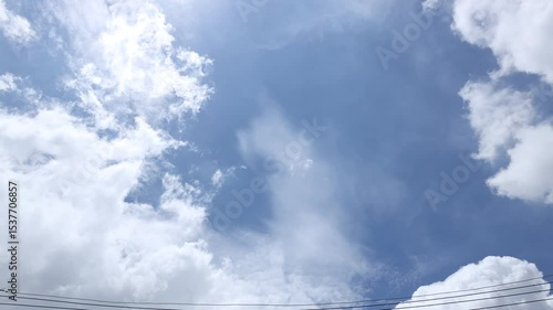 Time lapse of white and dark clouds moving against blue sky after rain. Summer nature weather sky. 4K video. 
