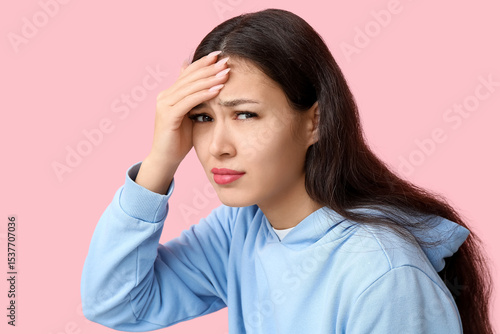 Young Asian woman suffering...