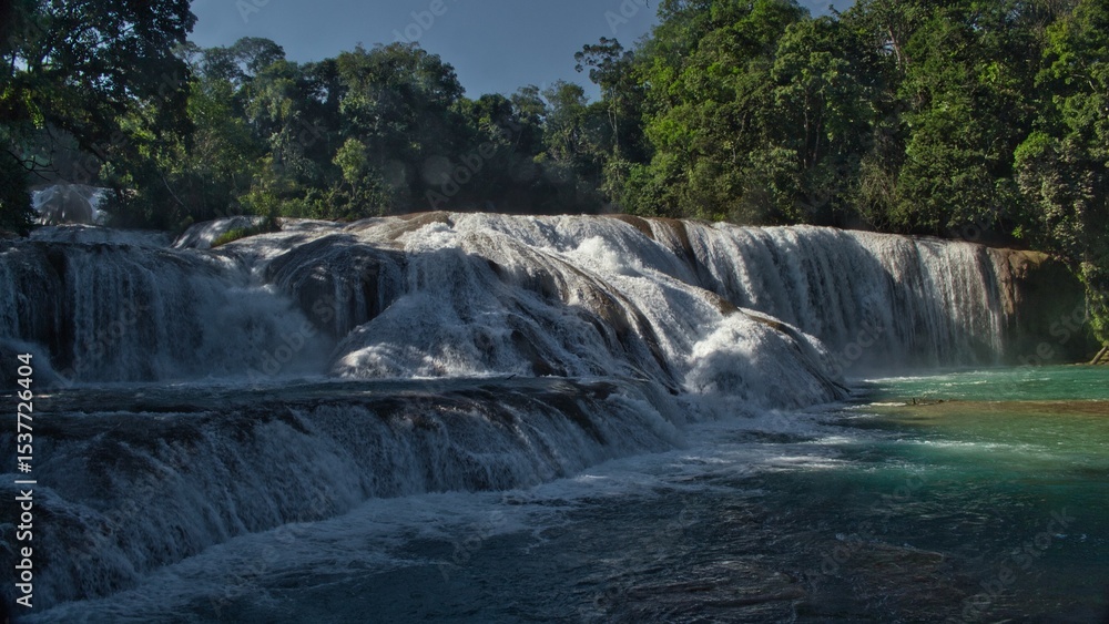 Obraz premium Agua Azul Waterfalls in Chiapas, Mexico — vibrant turquoise cascades flowing through lush jungle, a natural wonder of southern Mexico.