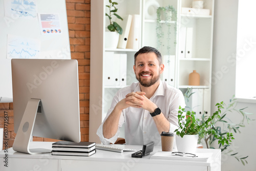Young businessman smiling a...
