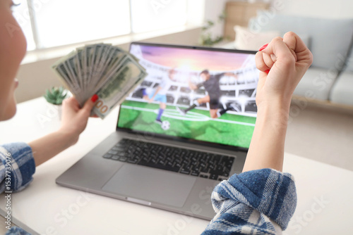 Happy young woman with mone...