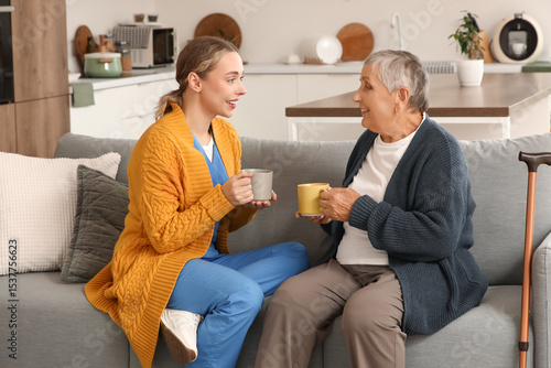Young caregiver with senior...