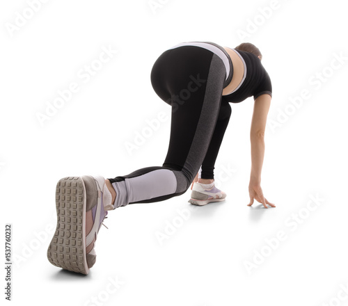 Sporty young woman preparin...