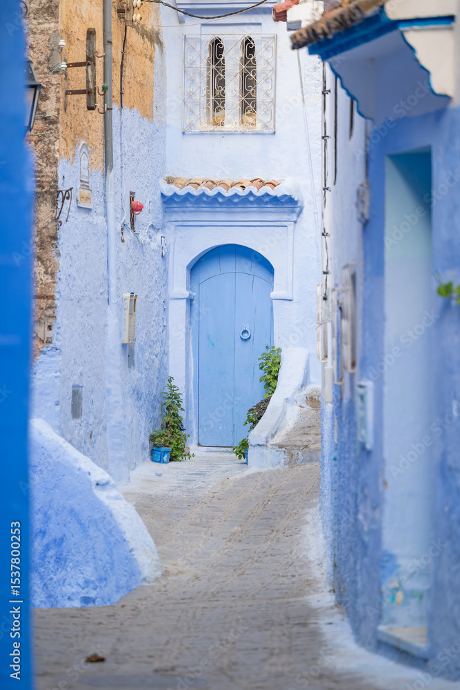 Naklejka premium Blue washed doorways in the old town Medina area of Chefchaouan located in the Rif Mountains of northwest Morocco