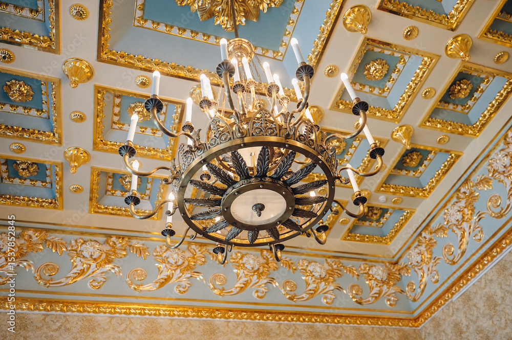 Obraz premium Classic elegant interior with chandelier and candle lights, vintage luxury design detail