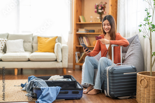 Fotografía Portrait of woman use technology of smartphone for hotel and resort booking online summer holiday travel system planning searching information weekend vacation trip