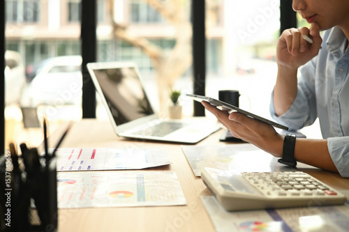 A Cropped image of a professional man analyzes marketing data, strategies, and KPIs to optimize digital campaigns