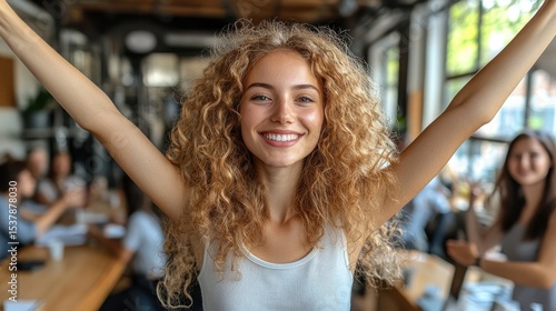Wallpaper Mural Happy woman with arms raised in cafe, colleagues in background Torontodigital.ca