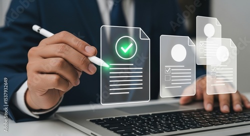 Businessman using laptop and digital pen is checking digital documents with electronic signature