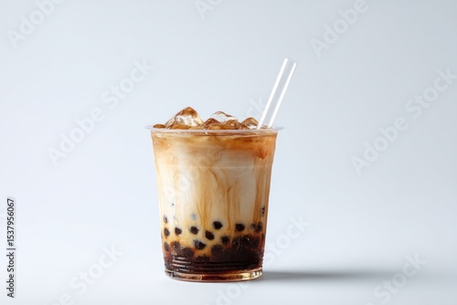 Iced bubble tea served in a clear cup, offering a clean and refreshing drink with toppings.