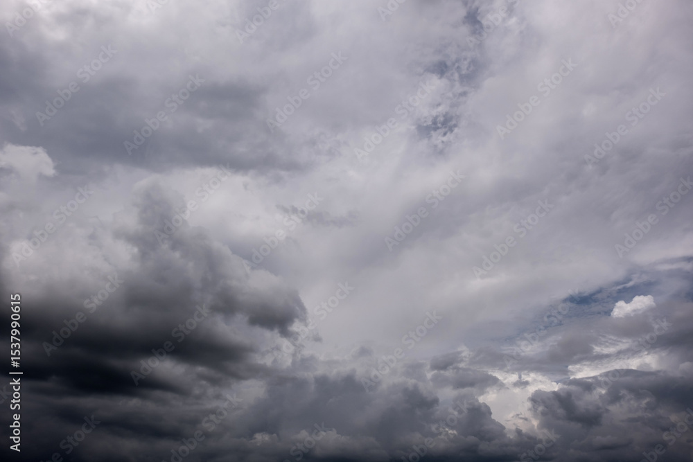 Obraz premium Dark sky with stormy clouds. Dramatic sky rain,Dark clouds before a thunder-storm,clouds before rain